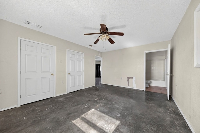 5408 E Loop 250e Unit A, Midland, TX 79705 - unfurnished bedroom with unfinished concrete floors, a textured ceiling, and a ceiling fan