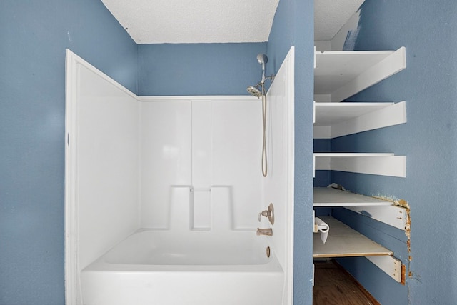 5408 E Loop 250e Unit A, Midland, TX 79705 - bathroom with shower / bath combination, wood finished floors, and a textured ceiling