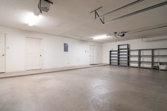 garage featuring a garage door opener and electric panel