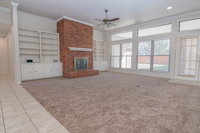 unfurnished living room with crown molding, a textured ceiling, ceiling fan, and light tile patterned floors