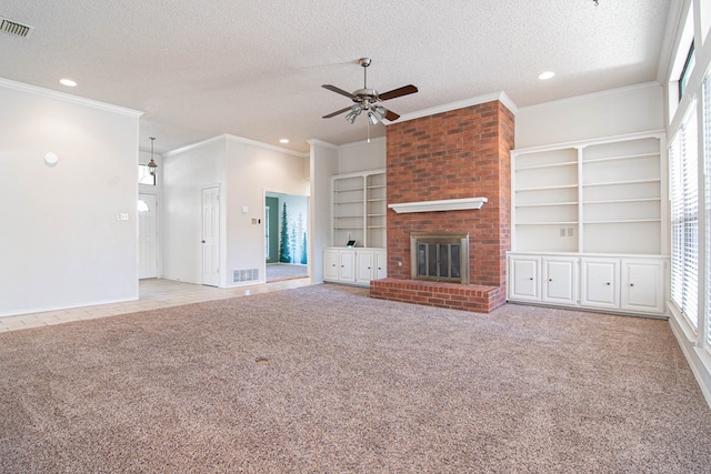 unfurnished living room featuring carpet flooring, a fireplace, a textured ceiling, a ceiling fan, and recessed lighting