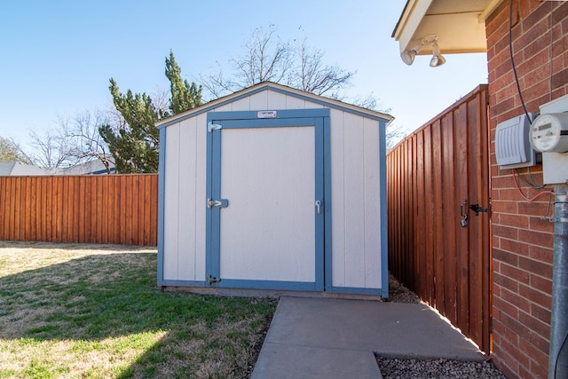 view of shed with fence