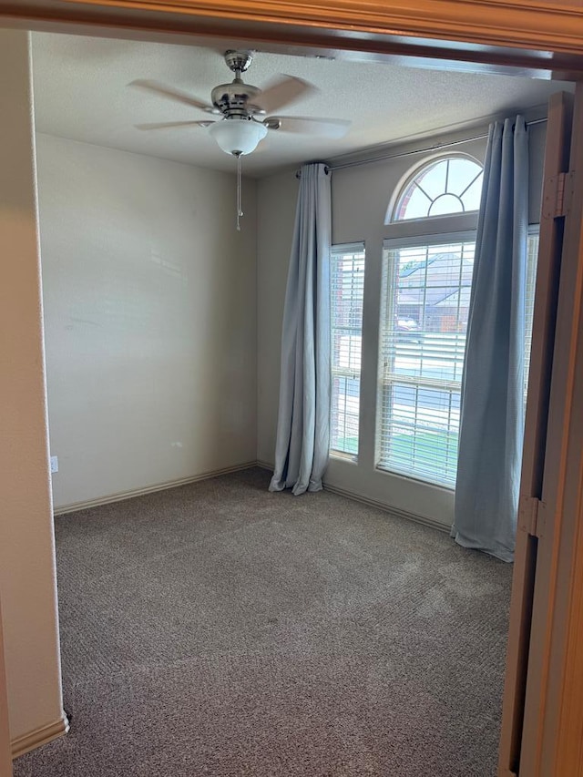 5702 San Miguel Ave, Midland, TX 79705 - spare room featuring carpet flooring and a ceiling fan