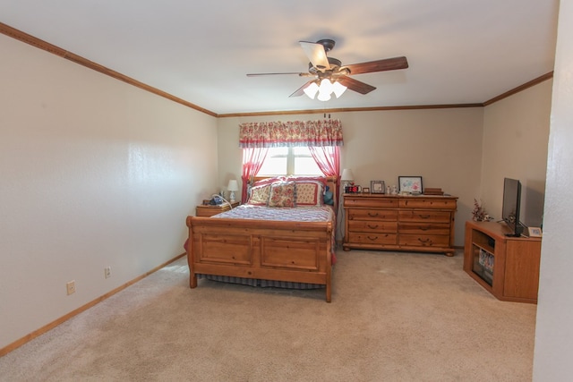 carpeted bedroom featuring ornamental molding and ceiling fan