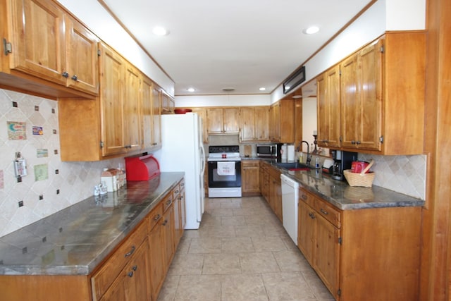 kitchen with white appliances, sink, decorative backsplash, and light tile patterned floors