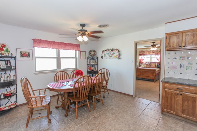 dining area with plenty of natural light and ceiling fan