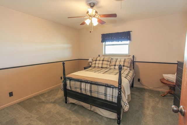 bedroom with ceiling fan and dark carpet