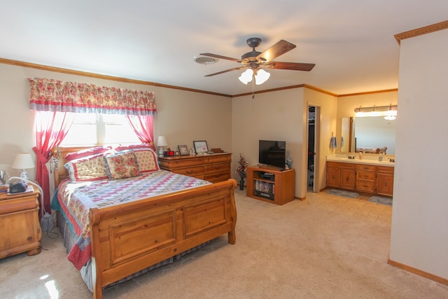 bedroom with connected bathroom, crown molding, light colored carpet, and ceiling fan