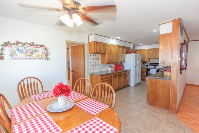 dining room featuring ceiling fan