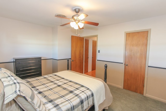 bedroom featuring ceiling fan and light carpet