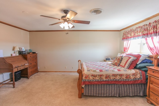 carpeted bedroom featuring crown molding and ceiling fan