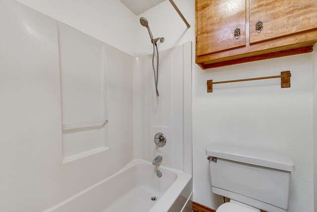 bathroom with toilet and shower / bathtub combination