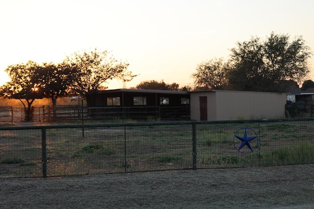 yard at dusk with an outdoor structure