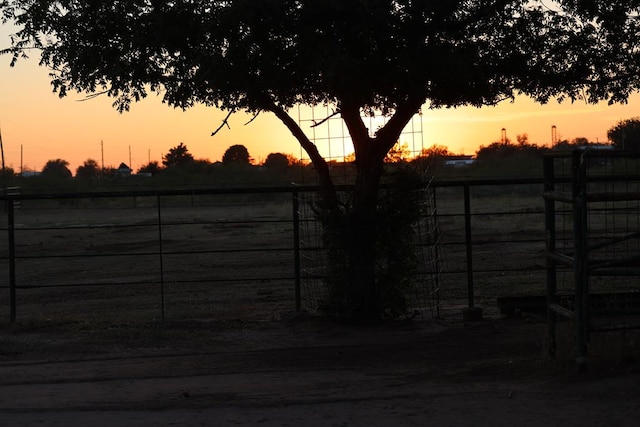 view of gate at dusk