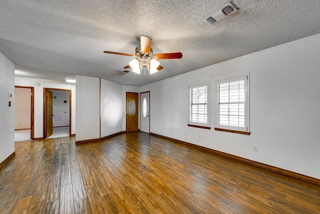 4600 S County Rd 1185, Midland, TX 79706 - empty room featuring a ceiling fan, a textured ceiling, visible vents, and hardwood / wood-style floors