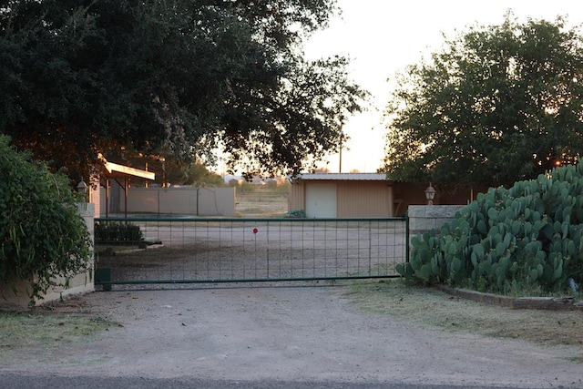 view of gate at dusk