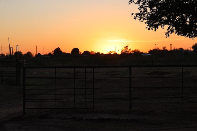 view of gate at dusk