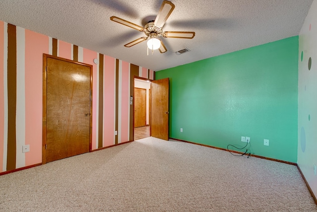 4600 S County Rd 1185, Midland, TX 79706 - unfurnished bedroom with carpet flooring, a textured ceiling, visible vents, and baseboards