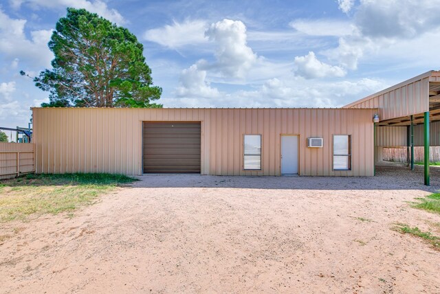 garage with fence