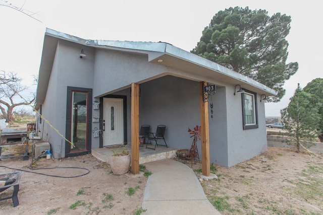 view of front of home featuring stucco siding