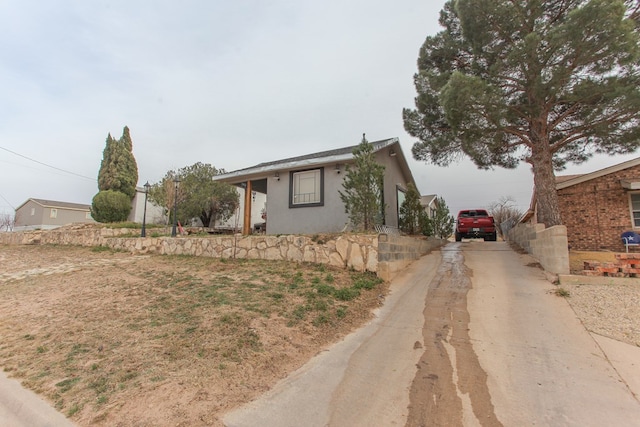 view of front of house featuring stucco siding