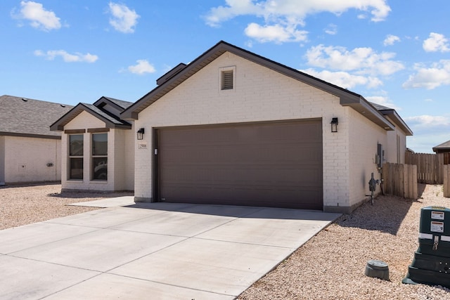 2906 Yellowstone Ct, Midland, TX 79705 - single story home featuring brick siding, a garage, and concrete driveway