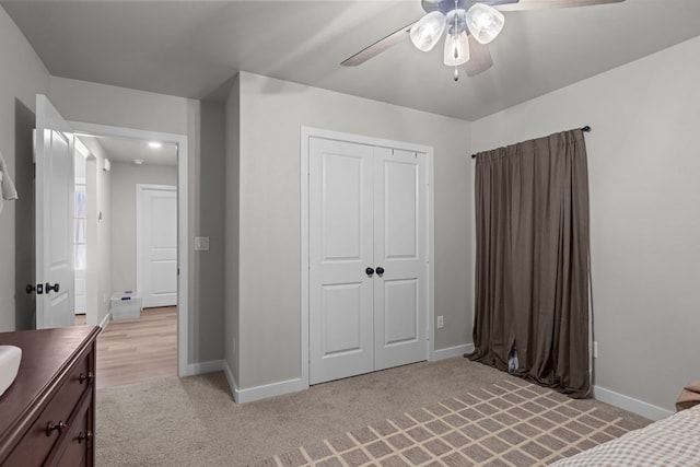 2906 Yellowstone Ct, Midland, TX 79705 - unfurnished bedroom featuring light carpet, a closet, baseboards, and a ceiling fan