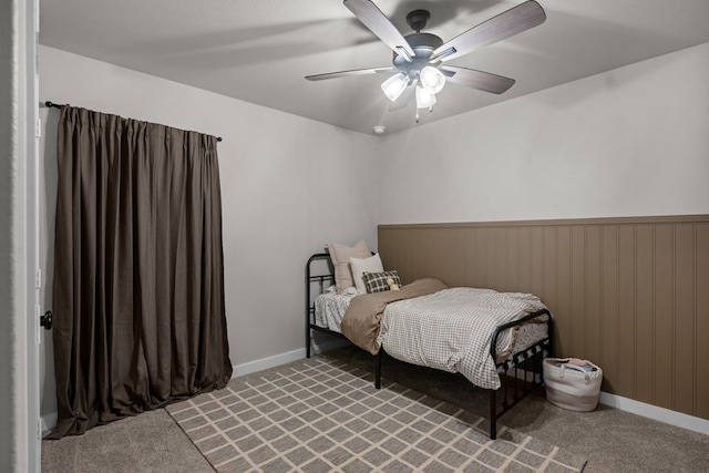 2906 Yellowstone Ct, Midland, TX 79705 - bedroom featuring carpet flooring, a wainscoted wall, and a ceiling fan