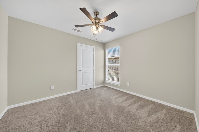 1317 Masquerade Blvd, Odessa, TX 79765 - carpeted spare room with baseboards and a ceiling fan