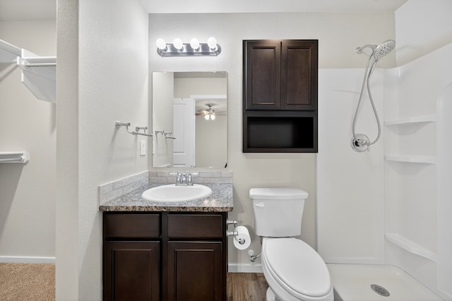 1317 Masquerade Blvd, Odessa, TX 79765 - bathroom with a shower, vanity, and a ceiling fan