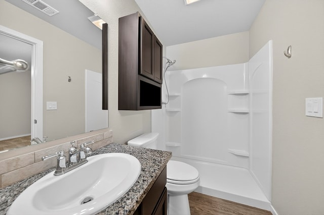 1317 Masquerade Blvd, Odessa, TX 79765 - full bath featuring vanity, a shower, and wood finished floors