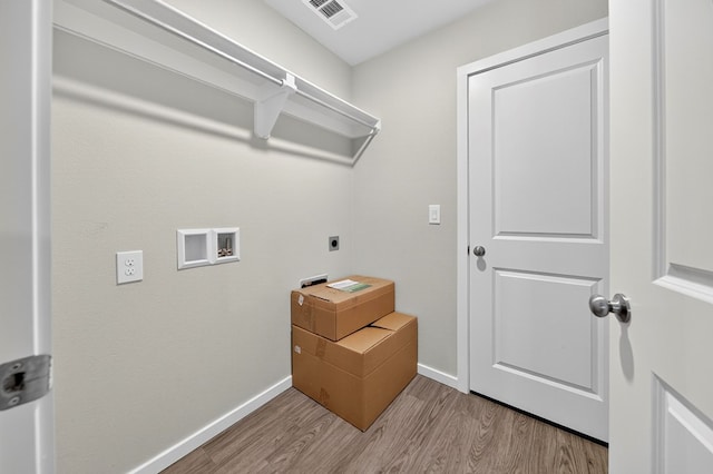 1317 Masquerade Blvd, Odessa, TX 79765 - washroom with hookup for an electric dryer, hookup for a washing machine, and light wood finished floors