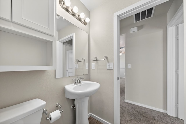 1317 Masquerade Blvd, Odessa, TX 79765 - bathroom featuring toilet and ceiling fan