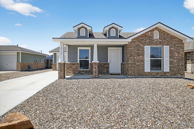 1317 Masquerade Blvd, Odessa, TX 79765 - view of front of property with brick siding and covered porch
