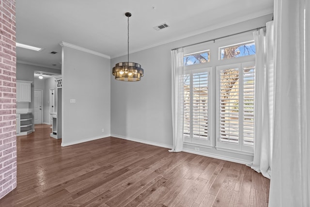 unfurnished dining area with baseboards, visible vents, ornamental molding, dark wood-style flooring, and an inviting chandelier