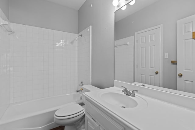 bathroom featuring bathtub / shower combination, vanity, and toilet