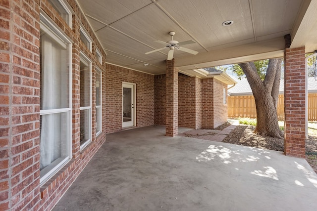 view of patio / terrace with fence and ceiling fan