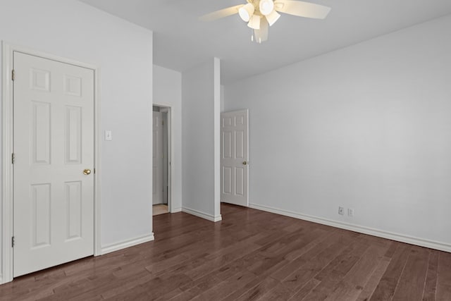 unfurnished bedroom with a ceiling fan, baseboards, and wood finished floors