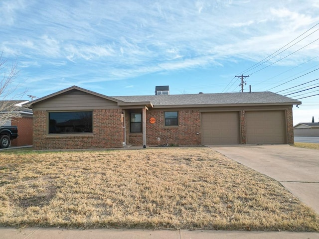 single story home featuring a garage and a front lawn