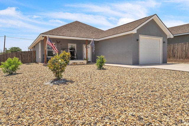 1404 Marijo, Big Spring, TX 79720 - single story home featuring concrete driveway, a garage, stucco siding, and roof with shingles