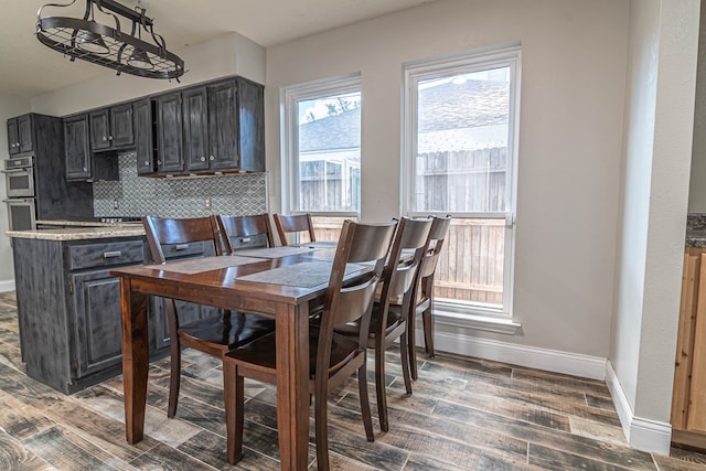 4404 Westminister Dr, Midland, TX 79707 - dining room featuring baseboards and wood finished floors