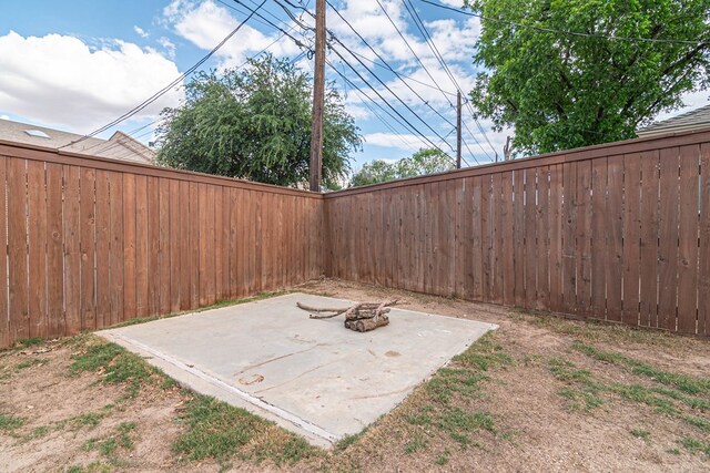 4404 Westminister Dr, Midland, TX 79707 - fenced backyard featuring a patio