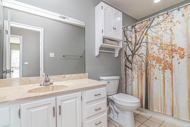 4404 Westminister Dr, Midland, TX 79707 - bathroom featuring tile patterned flooring, vanity, and toilet