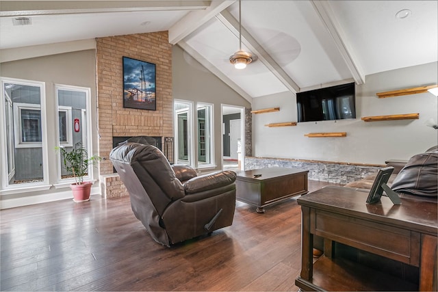 4404 Westminister Dr, Midland, TX 79707 - living room featuring beamed ceiling, a fireplace, dark wood-style flooring, and high vaulted ceiling