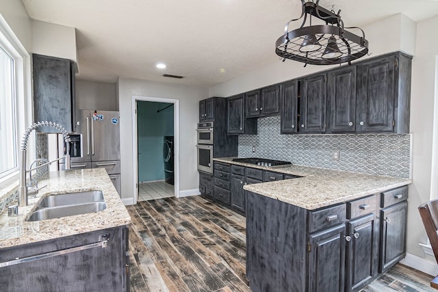 4404 Westminister Dr, Midland, TX 79707 - kitchen with a sink, dark wood-type flooring, stainless steel appliances, baseboards, and recessed lighting