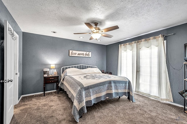 carpeted bedroom with a textured ceiling, a textured wall, baseboards, and ceiling fan