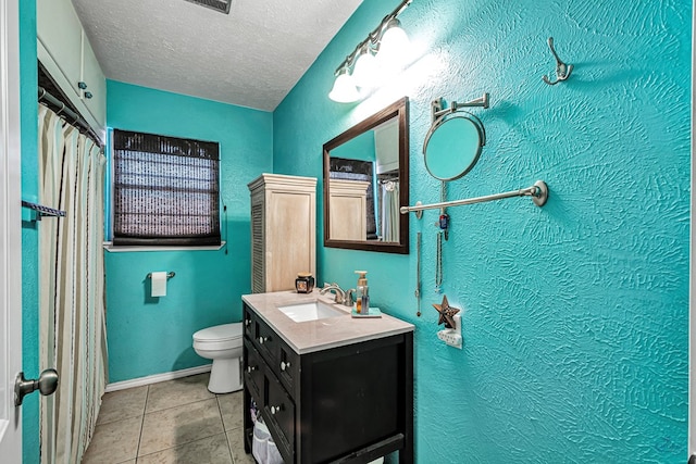 full bathroom with vanity, a textured ceiling, tile patterned floors, toilet, and a textured wall