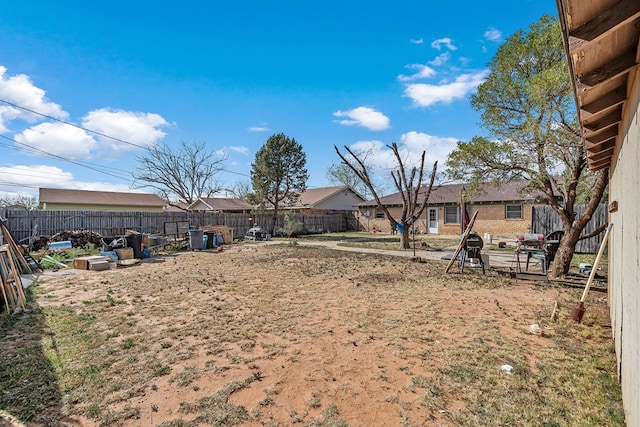 view of yard with a fenced backyard