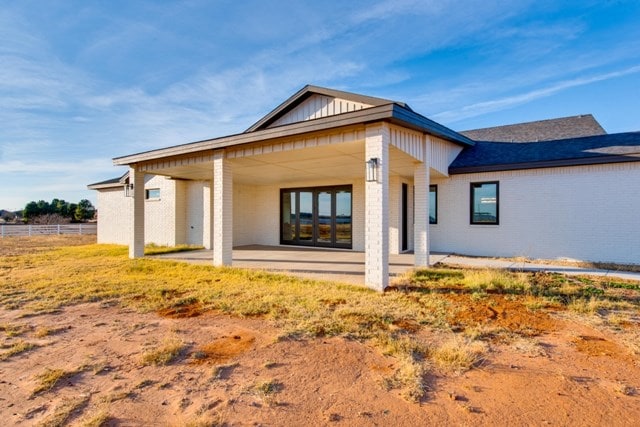 rear view of property featuring a patio