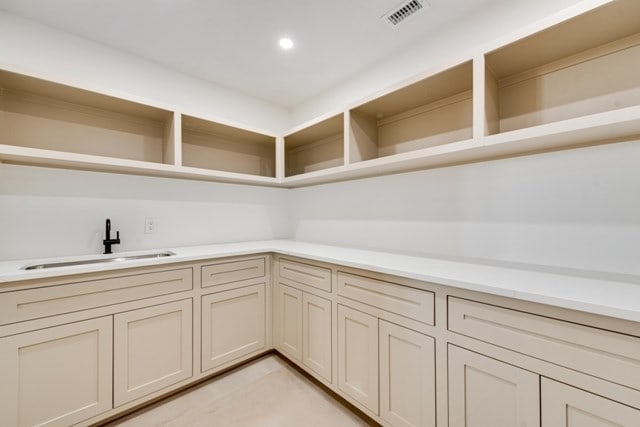 kitchen featuring sink and cream cabinets